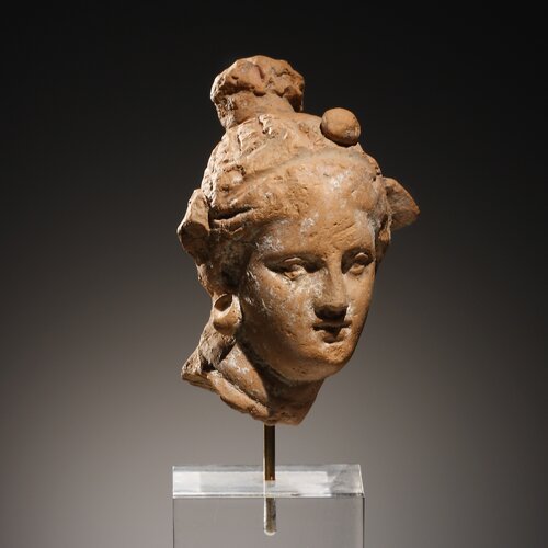 A Head of a Female Statuette with Wreath